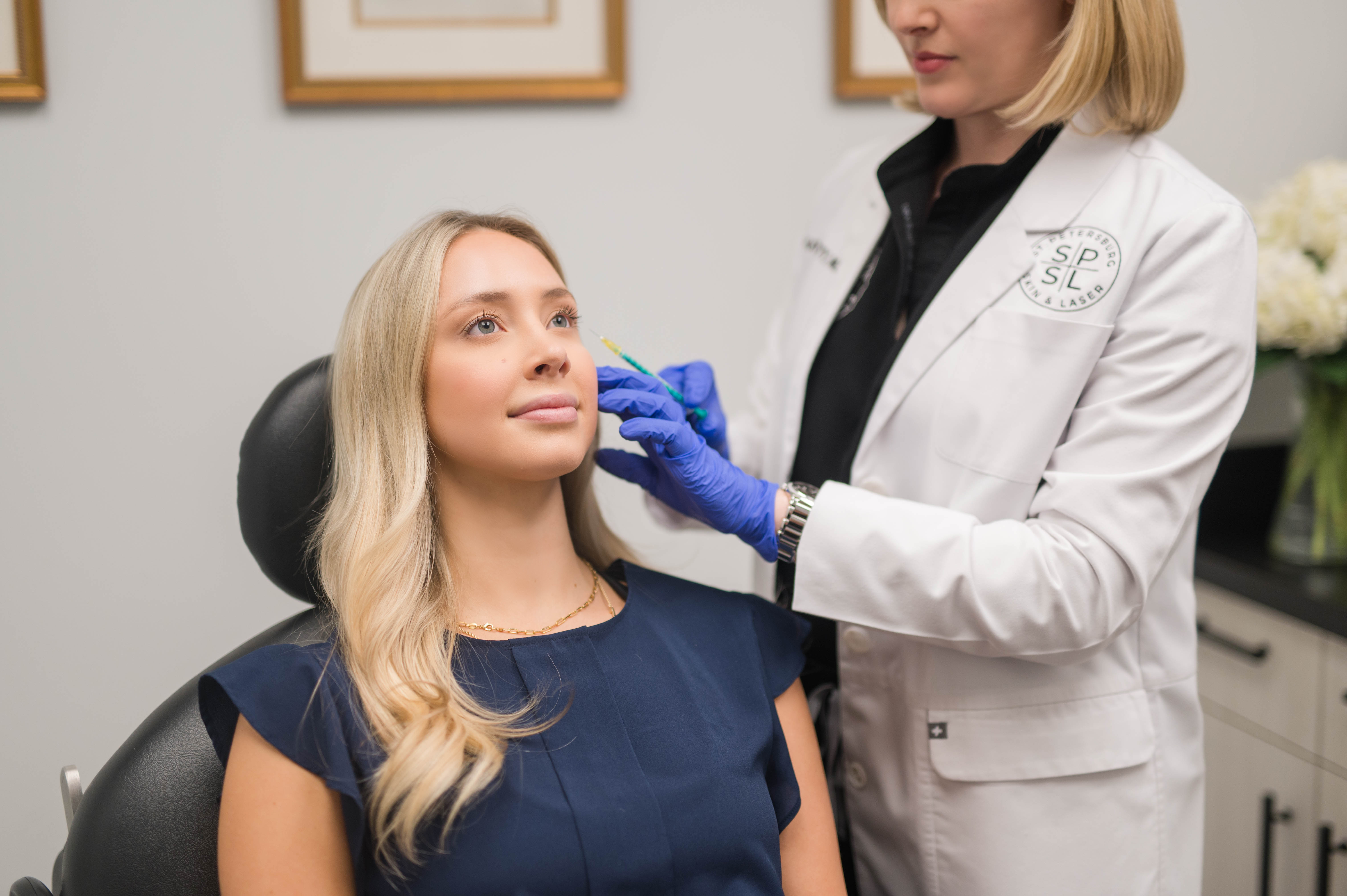 Person getting dermal fillers and wrinkle relaxers via injection